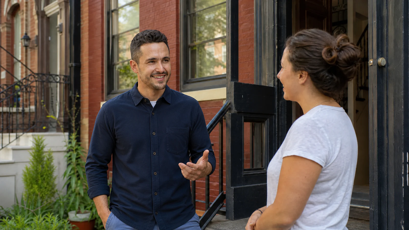 Ben speaking with a neighbor at their DC rowhouse doorstep